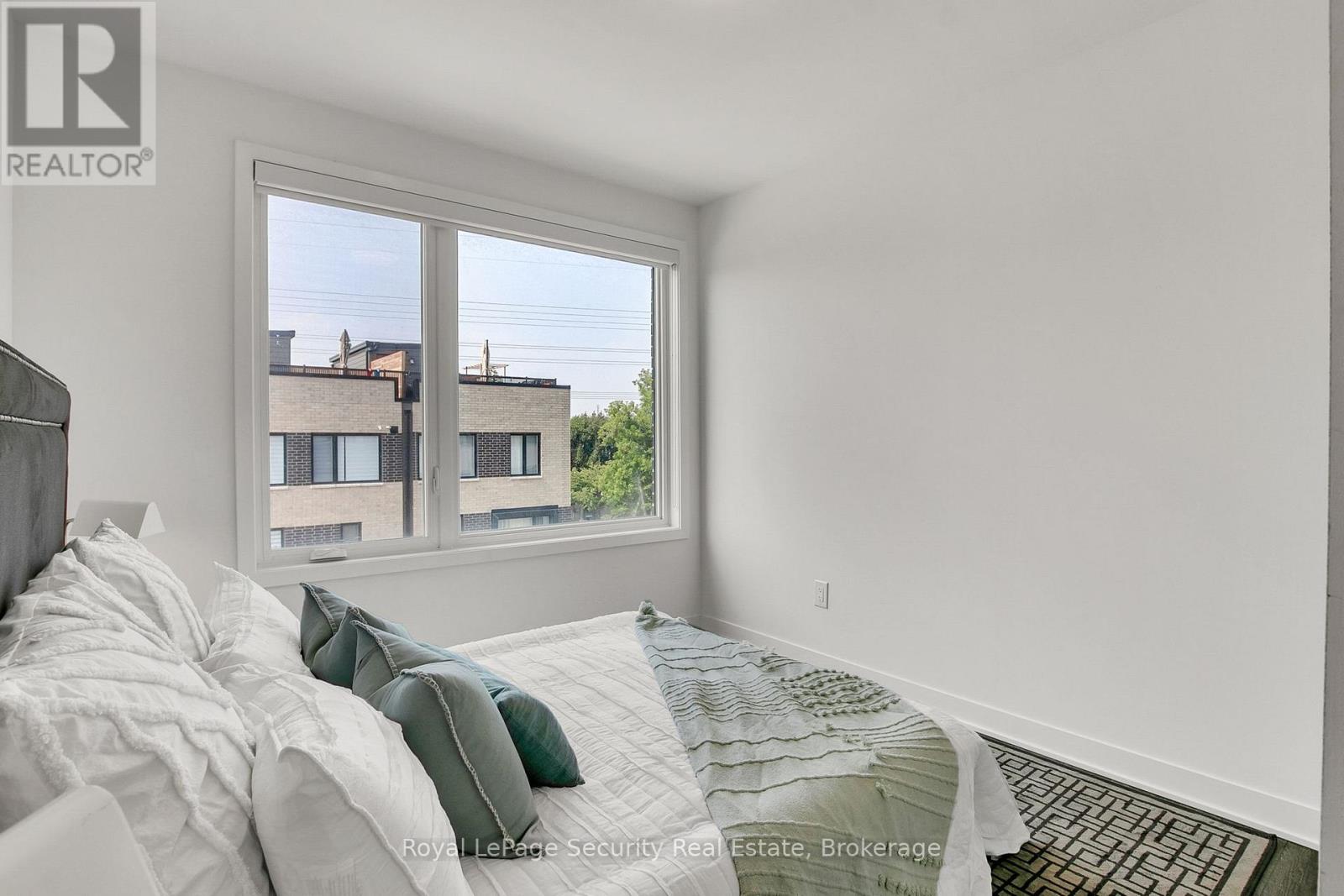 Th 22 - 40 Ed Clark Gardens, Toronto, Ontario  M6N 0B5 - Photo 26 - W12290461