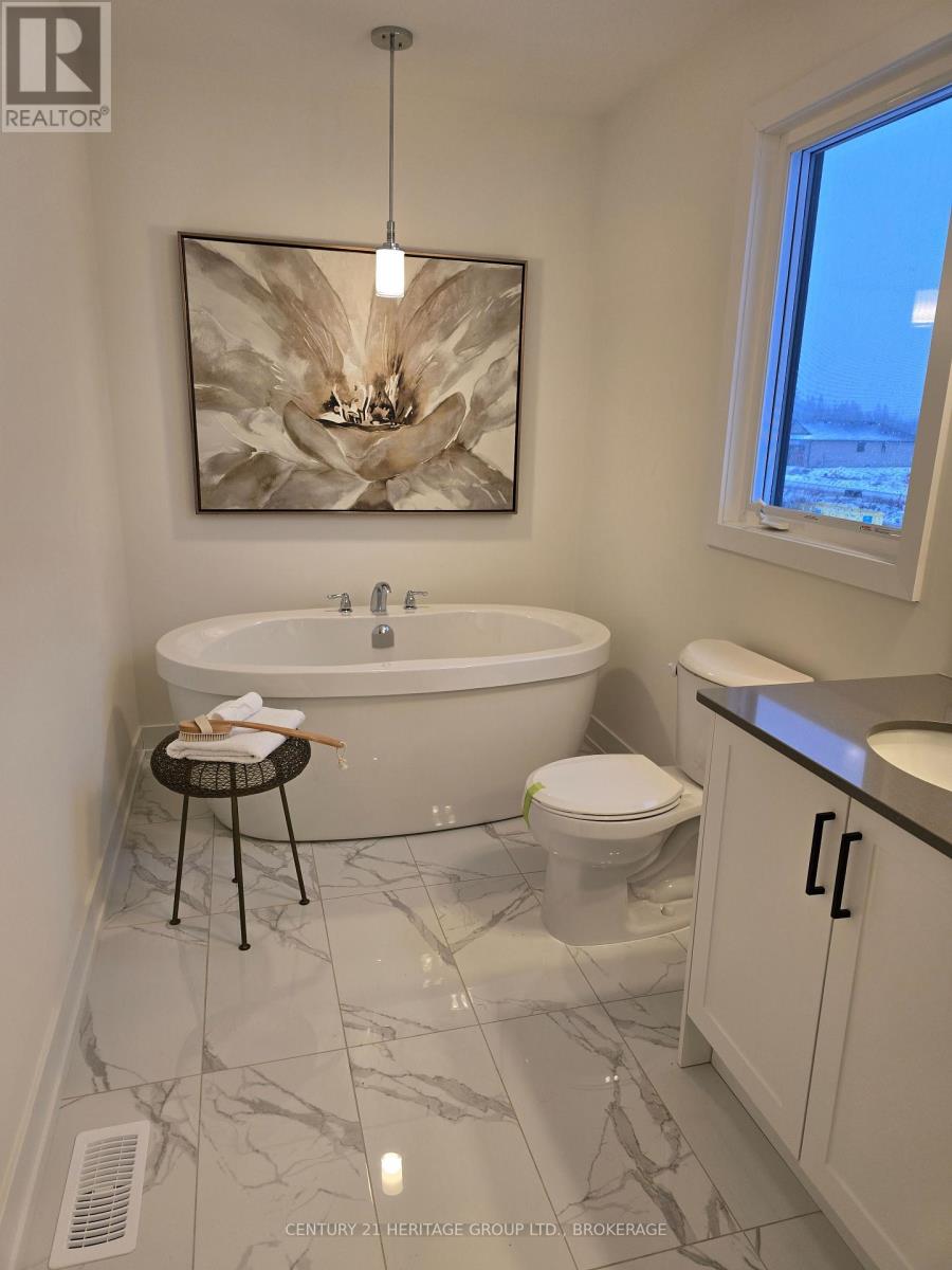 58 Dusenbury Drive, Loyalist, Ontario  K0K 2H0 - Photo 13 - X12263382