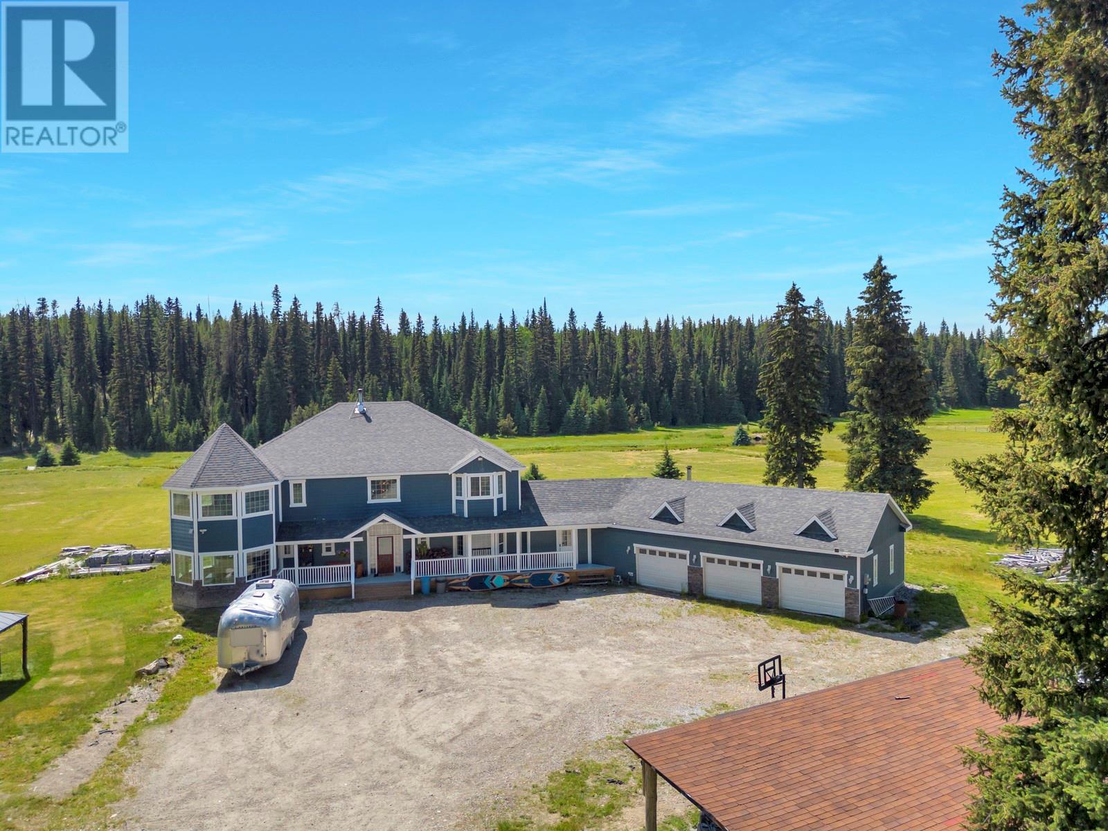 9205 Mcculloch Road Kelowna, British Columbia A rare opportunity to own 78 stunning acres in scenic Joe Rich—just 40 minutes from Kelowna! This expansive 6-bedroom + den, 5-bath home (with 3 private ensuites!) offers nearly 5,000 sq.ft. of living space—perfect for large families, multi-generational living, or anyone seeking privacy, freedom, and a peaceful rural lifestyle. Bonus: your own private creek runs through the property. The custom layout features oversized bedrooms, walk-in closets, multiple living areas, formal dining, ample storage, and a spacious triple garage. Numerous system upgrades have been completed for comfort and long-term efficiency—including a high-efficiency boiler and water tank ($30K+), new water pump and pressure tank with on-demand valve, full water filtration system, pellet stove, wood fireplace, garage heater, and wall-mounted electric heaters throughout. Interior improvements include updated lighting, new flooring and fresh paint in key areas, a fully renovated ensuite with heated floors, tongue-and-groove wood ceilings, newer appliances, and most exterior doors replaced—including a $10K high-end accordion door opening onto the back patio. Suite potential exists in the east wing of the home, with hookups already in place. With panoramic views, a fenced dog run, endless parking, and wide-open space for animals, recreation, or hobby farming—this is your chance to live the lifestyle you've been dreaming of. Just 4 mins to Hydraulic Lake, 30 minutes to Big White, and 50 minutes to YLW! (id:48254)