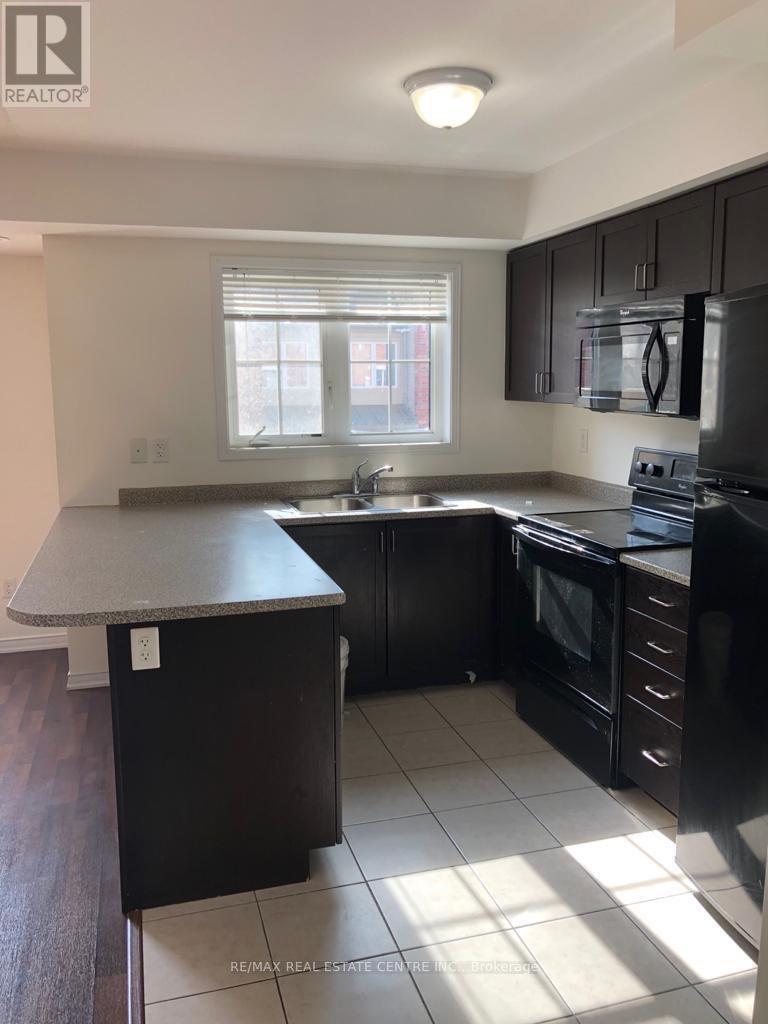 9 - 47 Hays Boulevard, Oakville, Ontario  L6H 0J1 - Photo 3 - W12303761