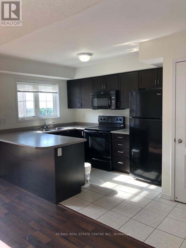 9 - 47 Hays Boulevard, Oakville, Ontario  L6H 0J1 - Photo 5 - W12303761