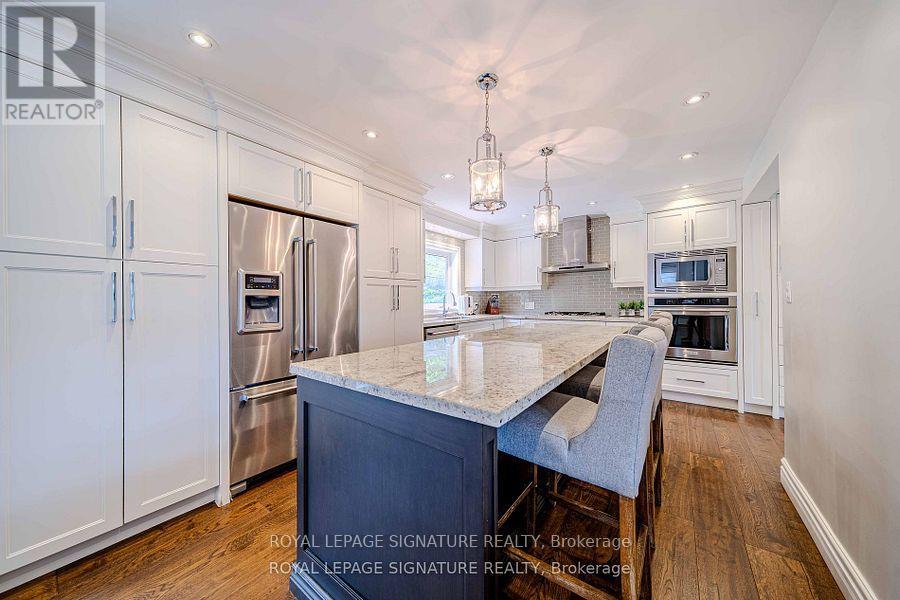41 Mayo Drive, Toronto, Ontario  M6L 2X4 - Photo 6 - W12306348