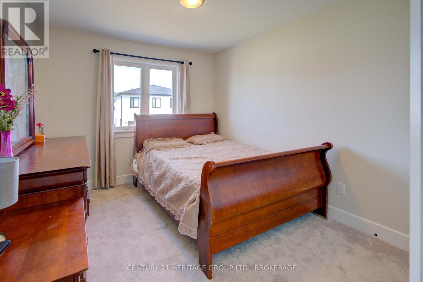 28 Dusenbury Drive, Loyalist, Ontario  K0H 2H0 - Photo 34 - X12308183