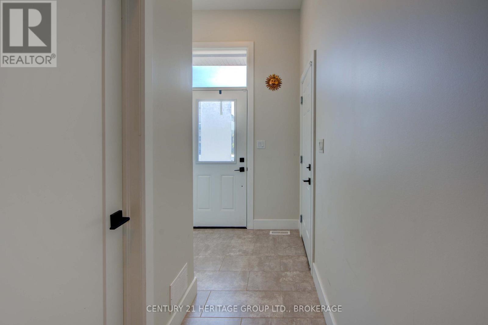 28 Dusenbury Drive, Loyalist, Ontario  K0H 2H0 - Photo 9 - X12308183