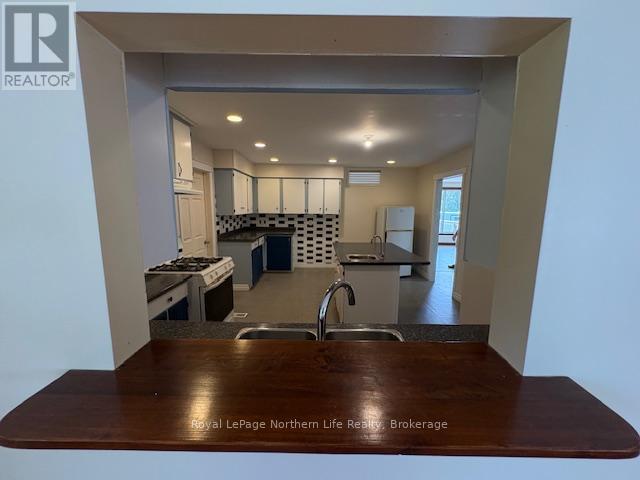 24-26 Spruce Drive, Temagami, Ontario P0H 2H0 - Photo 14 - X12329982