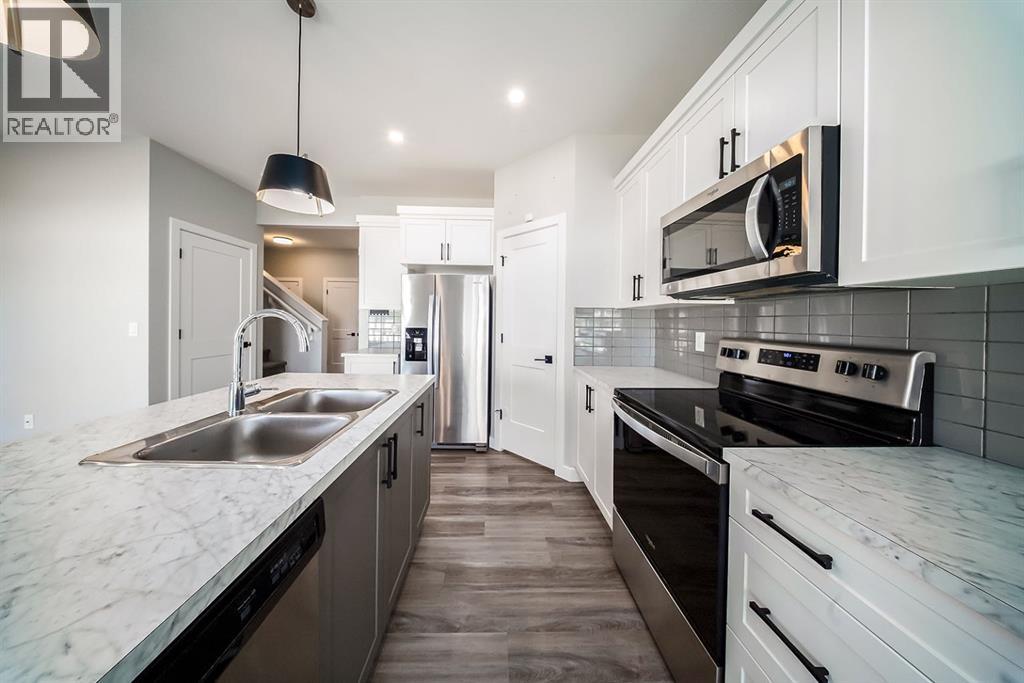 88 Henderson Crescent, Penhold, Alberta  T0M 1R0 - Photo 8 - A2245782