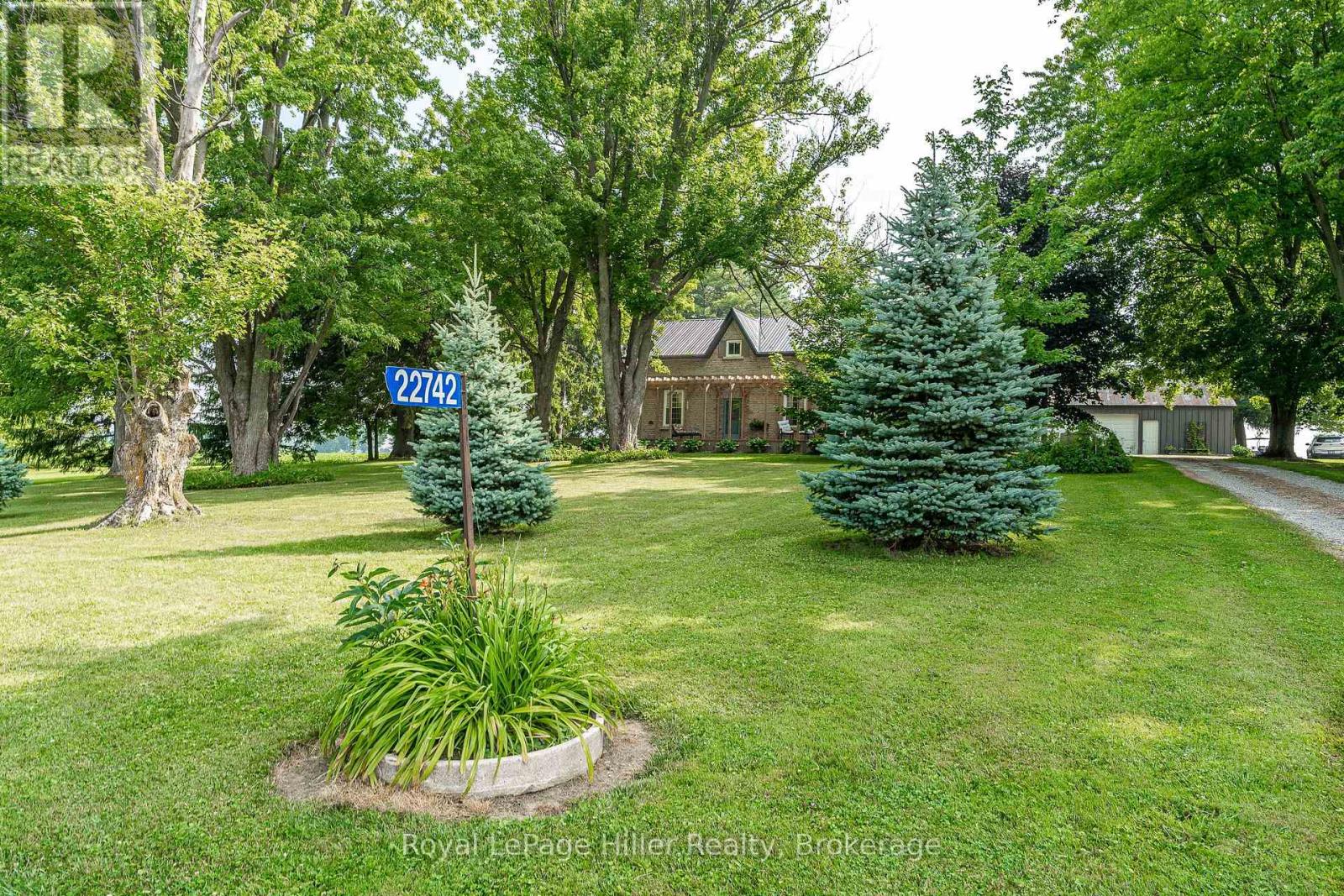 22742 Nissouri Road Thames Centre, Ontario Welcome to this stunning 4.69-acre country property offering a unique blend of character and contemporary updates. This home has had a complete renovation in the last five years. Set in a picturesque and private setting, this beautifully maintained historic home features an addition, a wrap around pergola deck and numerous modern upgrades, making it a rare find for those seeking both charm and functionality. Step inside to discover a bright and spacious interior with a new kitchen, perfect for family meals and entertaining. Both the 3-piece and 4-piece bathrooms have been tastefully renovated and include heated floors for year-round comfort. The home also features a warm and inviting family room addition, a dedicated office, a cozy living room, and a formal dining area ideal for gatherings and celebrations. At the rear of the home, a mudroom leads out to a large new deck providing one of the many peaceful spaces to enjoy the outdoors of this property. Upstairs, you'll find four comfortable bedrooms, including one housed in the newest upper-level addition, offering ample space for family or guests. The grounds are equally impressive, with a small pasture at the front, a small creek, and walking trails that wind through the property complete with two charming footbridges. Whether you are enjoying a morning walk or an evening by the firepit, the natural beauty is all around. Additional outbuildings include a detached garage with a workshop at the back and includes electricity, a granary, and a barn with some new doors. Mature trees throughout the property add to the peaceful ambiance and provide shade, privacy, and a true country feel. This is an opportunity to own a well-loved country home that perfectly balances historic charm with modern living. Come explore and fall in love with everything this unique property has to offer. (id:48254)