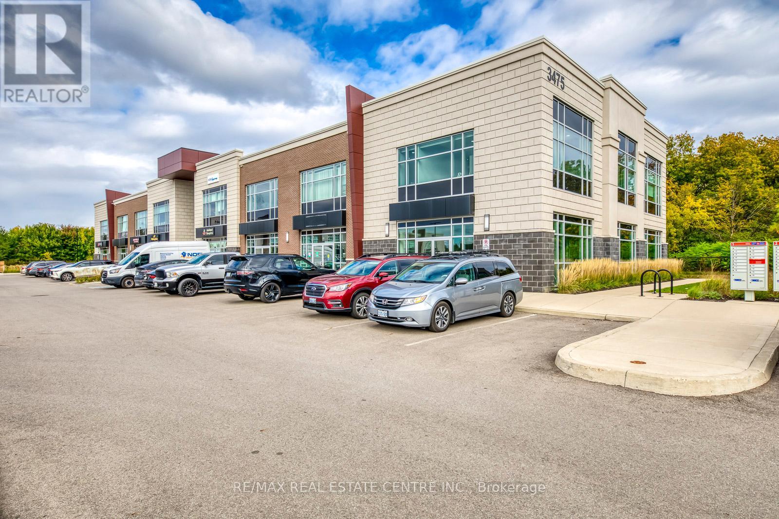 211 - 3475 Rebecca Street, Oakville, Ontario  L6L 0H3 - Photo 1 - W12342624