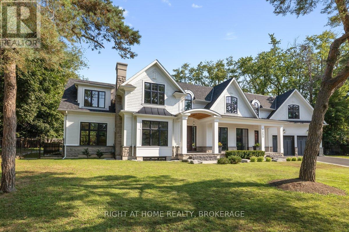 Welcome to 1253 Crawford Court, an exceptional custom-built luxury estate situated in the prestigious Morrison neighborhood of South Oakville. Located on a premium, mature tree-lined pie-shaped lot within a private cul-de-sac, this property represents a rare opportunity. This distinguished residence offers over 7,700 square feet of meticulously designed, flawlessly finished family living space.  Constructed with timeless elegance and equipped with state-of-the-art smart home technology, this architectural masterpiece features soaring 10-foot ceilings, wide-plank engineered hardwood flooring, and a striking two-story family room that floods the home with natural light. The open-concept gourmet kitchen is tailored for culinary enthusiasts, showcasing custom full-height face-frame cabinetry, a spacious quartz island, and high-end Wolf and SubZero appliances.  Intended for sophisticated entertaining, the residence includes expansive formal living and dining rooms, a fully equipped home theater, and seamless indoor-outdoor transitions to a landscaped backyard oasis.  Upstairs, the luxurious primary suite offers a tranquil retreat, complete with a spa-like ensuite featuring heated floors, a soaking tub, and an oversized custom walk-in closet. Three additional bedrooms, each with private ensuite baths, a sunlit bonus room, and a spacious, fully equipped laundry area provide both comfort and practicality for the entire family. The lower level is equally impressive, encompassing a home gym, an oversized shower room, a wet bar with a wine fridge, and an stylish  lounge with a double-sided Napoleon fireplace.  Additionally, a private guest or nanny suite with a separate entrance affords privacy and flexibility for multigenerational living. Throughout the basement, radiant in-floor heating ensures year-round comfort.1253 Crawford Court transcends the concept of a home; it epitomizes an elevated lifestyle. (id:48254)