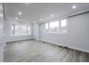 Empty room with visible vents, recessed lighting, baseboards, and wood finished floors