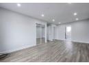 Unfurnished bedroom with recessed lighting, baseboards, multiple closets, and wood finished floors