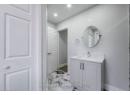 Bathroom with vanity and baseboards