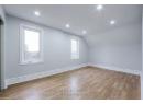 Bonus room featuring recessed lighting, baseboards, lofted ceiling, and wood finished floors