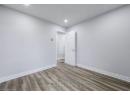 Spare room featuring wood finished floors and baseboards