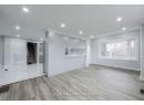 Unfurnished living room featuring recessed lighting, visible vents, light wood finished floors, and stairway
