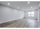 Unfurnished room with recessed lighting, wood finished floors, and baseboards