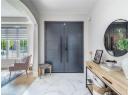 Foyer featuring light marble finish floors and recessed lighting