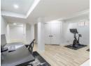 Home office featuring light wood-style floors and baseboards