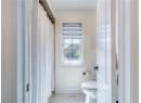 Bathroom featuring toilet and tile patterned floors