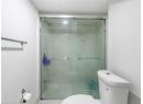 Bathroom with toilet and a shower stall
