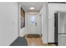 Entryway featuring light wood-type flooring and baseboards