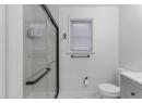 Bathroom with vanity and a stall shower