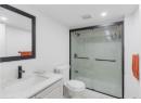 Full bathroom with vanity, a marble finish shower, recessed lighting, and marble finish floors