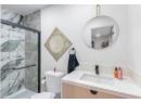 Full bath featuring vanity and a stall shower
