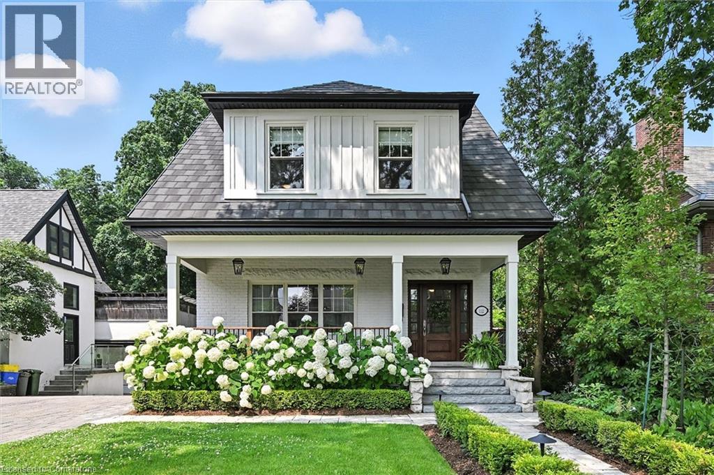 Set on one of Hamilton’s most coveted streets, this extraordinary Chedoke Avenue ravine property has been completely transformed through a $900k renovation. Reimagined between 2022 and 2025, this 4-level, 3966 sq ft century home blends timeless character with modern comfort — all on a rare 333-foot deep lot backing onto the prestigious Chedoke Golf Club. The exterior features a refreshed front porch, new windows throughout, and thoughtfully designed landscaping that enhances both beauty and privacy. The main floor offers a perfect balance of warmth and sophistication — ideal for family life and entertaining. A formal dining room with a gas fireplace flows into a welcoming living area, while the bright eat-in kitchen has been fully redesigned with quartz countertops, custom cabinetry, and generous space for gathering. Oversized windows frame the stunning backyard, creating a seamless connection to the outdoors. A rebuilt staircase leads to a serene primary retreat with a custom walk-in closet, Juliet balcony, and spa-like ensuite with a soaker tub and glass shower. This level also includes a full bathroom for the kids, bedroom-level laundry, and two spacious bedrooms designed with both comfort and function in mind. The third floor offers flexible living with a large family room, custom sliding wood door, built-in desk, full bathroom, and private guest bedroom — perfect for teens, guests, or working from home. The walkout basement adds even more versatility with a rec room, kitchenette, and another full bathroom — ideal for extended family or a private retreat. Outside, the backyard is a true extension of the home: a heated saltwater pool, expansive interlock patio, and tranquil ravine views set the stage for effortless summer entertaining. And when you're ready to explore, Locke Street is just a short stroll away — offering cafés, art galleries, and the vibrant lifestyle this neighbourhood is known for. This home truly offers you it all! (id:48254)