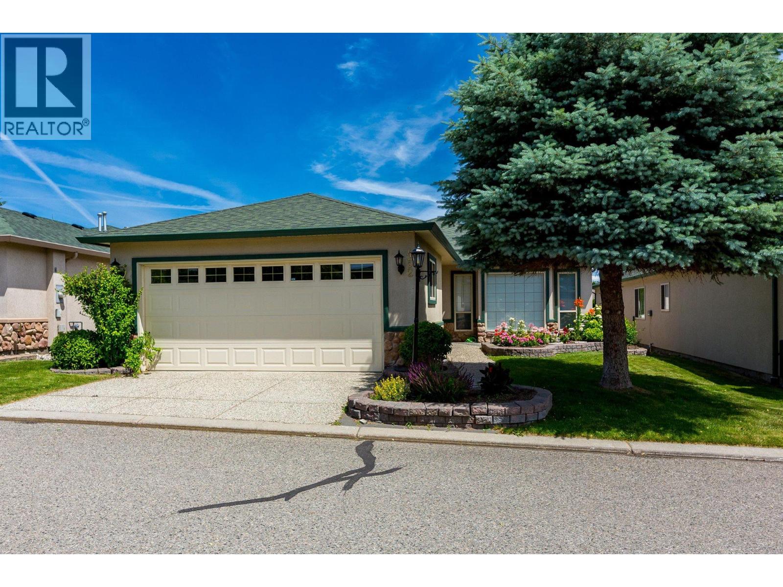 Quiet privacy, a sun-splashed addition, and carefree resort living—all inside West Kelowna’s sought-after 45-plus gated community. Tucked well away from Butt Road traffic yet only minutes to every daily convenience, #452 at Sun Village delivers the single-level lifestyle buyers crave: 2 bedrooms, 2 full baths, a bonus family room with gas fireplace, and a professionally built sun-room that pulls the lush backyard greenery right into your living space. Add level entry, an attached garage, and lock-and-leave security and you’ve got the Okanagan downsizer’s holy grail. Did we even mention the amenity rich clubhouse complex? The real magic happens at the clubhouse. Residents here swim year-round in a heated salt-water pool, unwind in the whirlpool & sauna, stay fit in a well-equipped gym, shoot pool with friends, raid an ever-growing library, craft in dedicated hobby rooms, or host events in the banquet hall complete with commercial kitchen. RV storage, scenic walking paths and an active social calendar  round out the ‘live-where-you-vacation’ vibe. (id:48254)