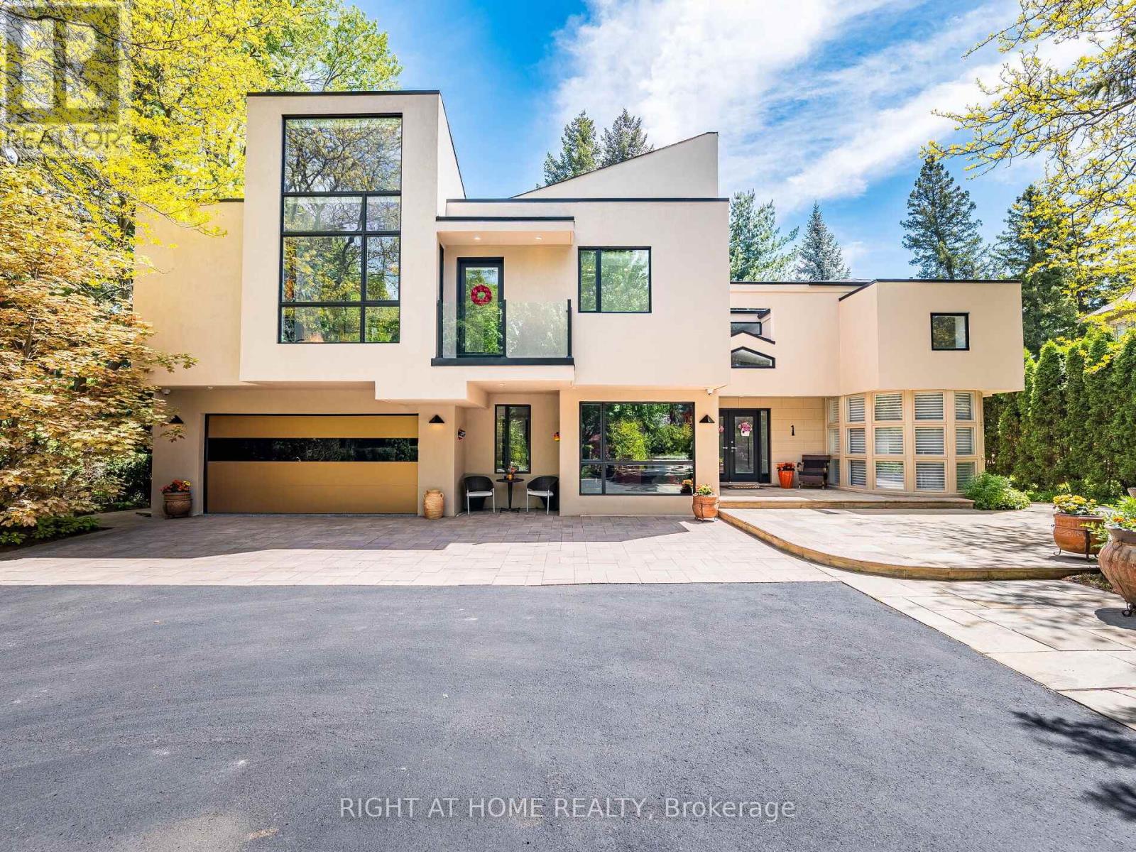 Discover This Hidden Gem Perfectly Situated In One Of The Most Central And Sought-After Areas Where Convenience Meets Tranquility. Tucked Away On A Quiet, Private Street Surrounded By Mature Trees, This Home Offers The Feeling Of Living In Your Own Private Park, Yet You Are Just Minutes From Everything. Enjoy The Best Of Both Worlds: Urban Convenience With Suburban Serenity.A Rare Opportunity To Own A Custom-Built Home That Seamlessly Blends Architectural Sophistication (Property Designed By The Famous Architect Rocco Maragna), Privacy, And Resort-Style Living. Nestled On An Ultra-Private, Professionally Landscaped Court Lot This 7,500 Sqf. Living Space Estate Offers An Unparalleled Lifestyle In One Of The Citys Most Sought-After Enclaves.Surrounded By Mature Trees And Lush Gardens, The Exterior Showcases Premium Stucco (2024), Upgraded Windows (2020), Roof Shingles (2024),An Extra-Long Drive Leads To A Spacious Attached Double Garage Featuring Epoxy Flooring.The Backyard Is A True Oasis, Redefining An Outdoor Oversized Luxury Pool, A Tranquil Waterfall And An Award-Winning Gib-San Hot Tub. Entertain Effortlessly On Elegant Stone Patios With Low-Maintenance Artificial Turf And Two Built-In Gas BBQs (Lynx) Enhancing The Outdoor Experience.Inside, The Interior Is Finished To The Highest Standard With Custom Hardwood Floors, Oversized Porcelain Tiles Imported From Europe, Walnut Refined Elegance Meets Modern Comfort Italian Doors, A Striking Glass-Panel Staircase, Ambient Lighting And A Fully Monitored Security System. Grand Living Areas And Spa-Inspired Bathrooms Offer Exceptional Comfort, While The Upper Level Hosts Four Luxurious Bedrooms (Double Master Suites), An Elevator Conveniently Connects All Three Levels Ensuring Accessibility For Years To Come.The Original Bedroom On The First Level Is Currently Being Used As The Main Office. It's Located Near Top-Rated Schools And Just Minutes From The Prestigious St. Georges Golf And Country Club. (id:48254)