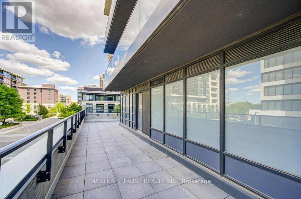 209 - 18 Water Walk Drive, Markham, Ontario  L3R 6L5 - Photo 2 - N12321522