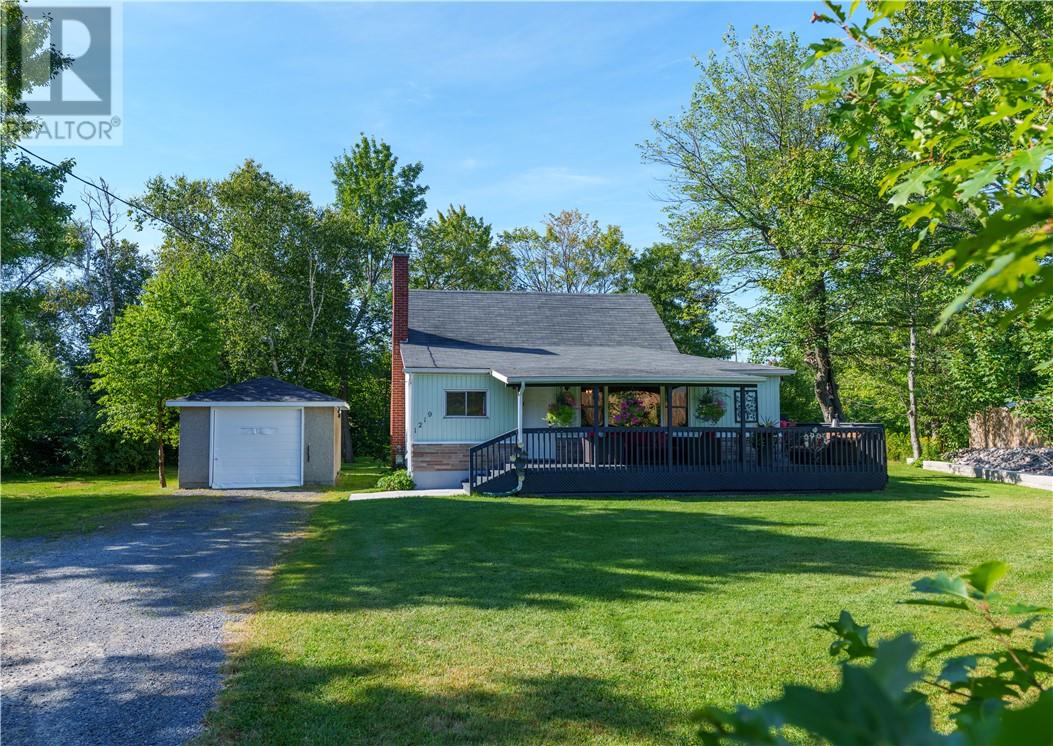 This well-maintained 2-bedroom, 1-bathroom home is full of character and convenience. Step inside a cozy living room featuring a warm fireplace for those cold fall & winter nights & sliding barn doors for an added touch of style. The main floor laundry makes everyday living simple and practical. Enjoy your morning coffee or summer evenings on the spacious covered front deck, overlooking the private, landscaped yard. Out back, you’ll find plenty of room to relax or entertain with your very own party shed, perfect for gatherings with family and friends. A detached 14’ x 22’ garage offers excellent storage or workshop potential, along with ample parking space in the driveway. Sitting on an oversized lot with potential to sever, this property offers exciting possibilities for future investment while still giving you the space and privacy to enjoy today. Located in sought-after Minnow Lake, you’re close to trails, parks, shopping, and all amenities while still enjoying peace and privacy at home. Don’t miss your chance to own this move-in ready property! (id:48254)