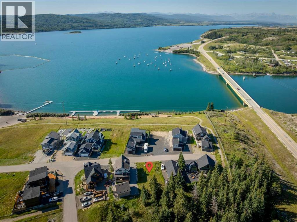 404 Cottageclub Grove, Rural Rocky View County, Alberta  T4C 1B1 - Photo 4 - A2251524