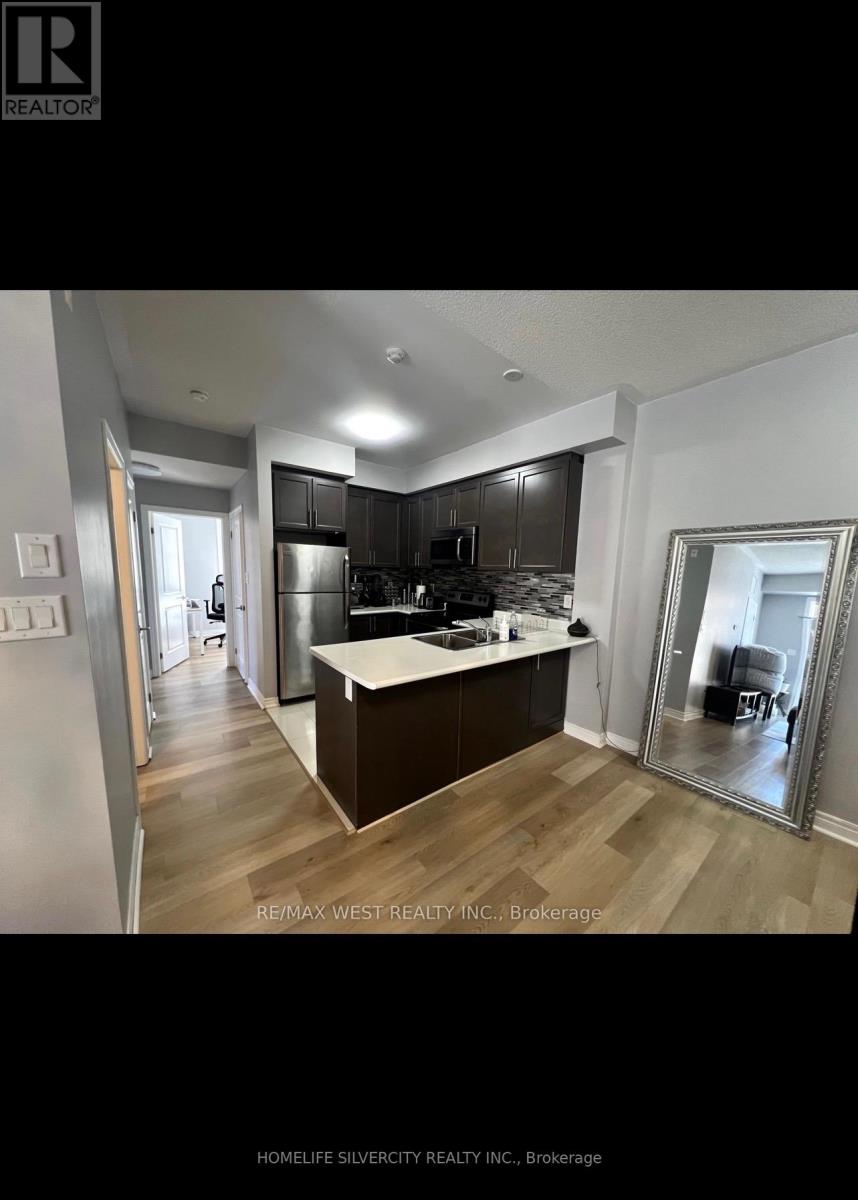 305 - 269 Georgian Drive, Oakville, Ontario  L6H 0L3 - Photo 6 - W12369287