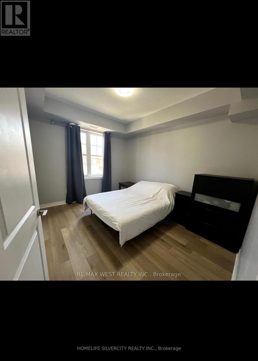 305 - 269 Georgian Drive, Oakville, Ontario  L6H 0L3 - Photo 8 - W12369287