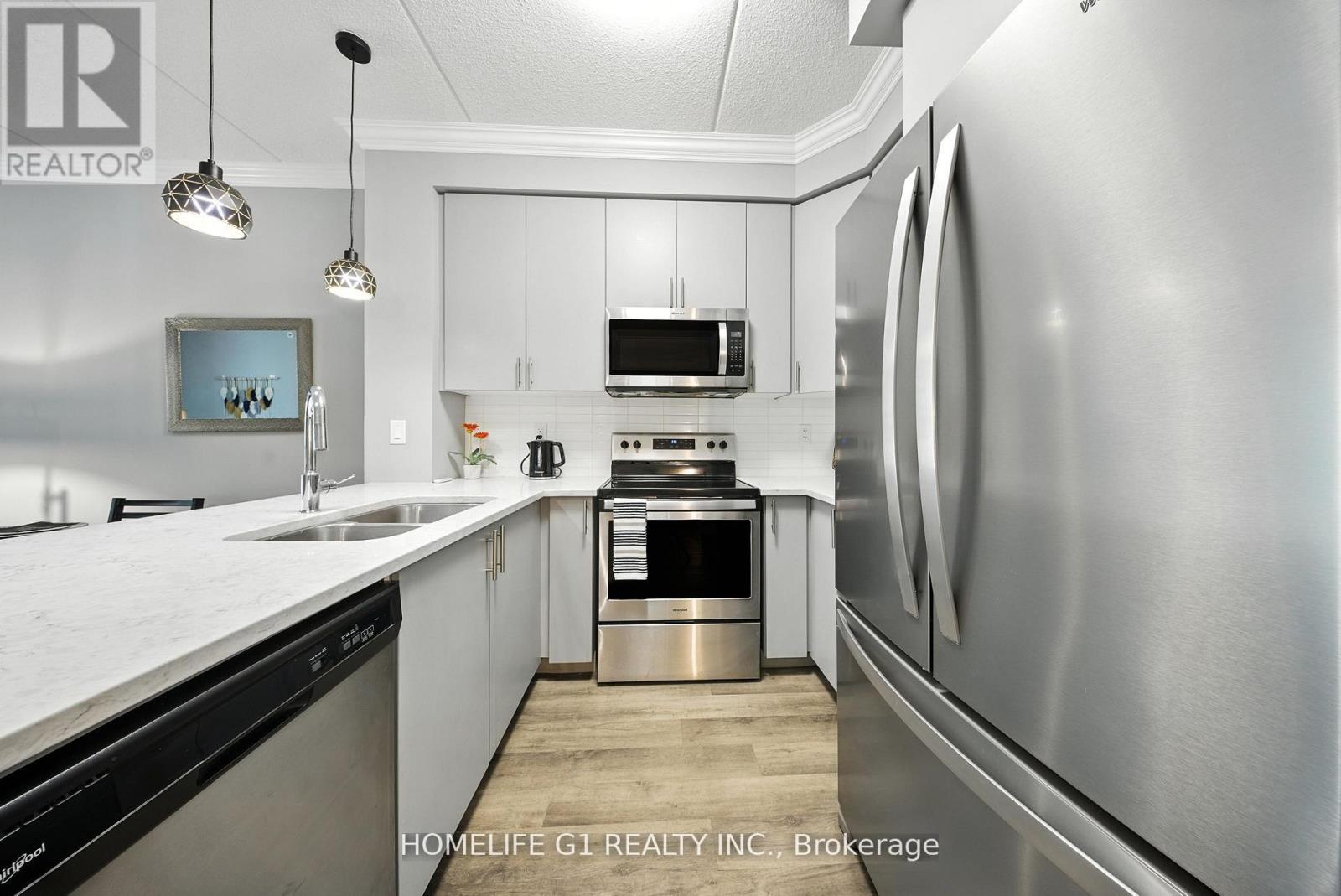 215 - 610 Farmstead Drive, Milton, Ontario  L9T 8X5 - Photo 9 - W12369268