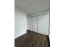 Unfurnished bedroom with dark wood-type flooring and a closet