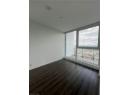 Unfurnished room with dark wood-style floors, recessed lighting, and expansive windows