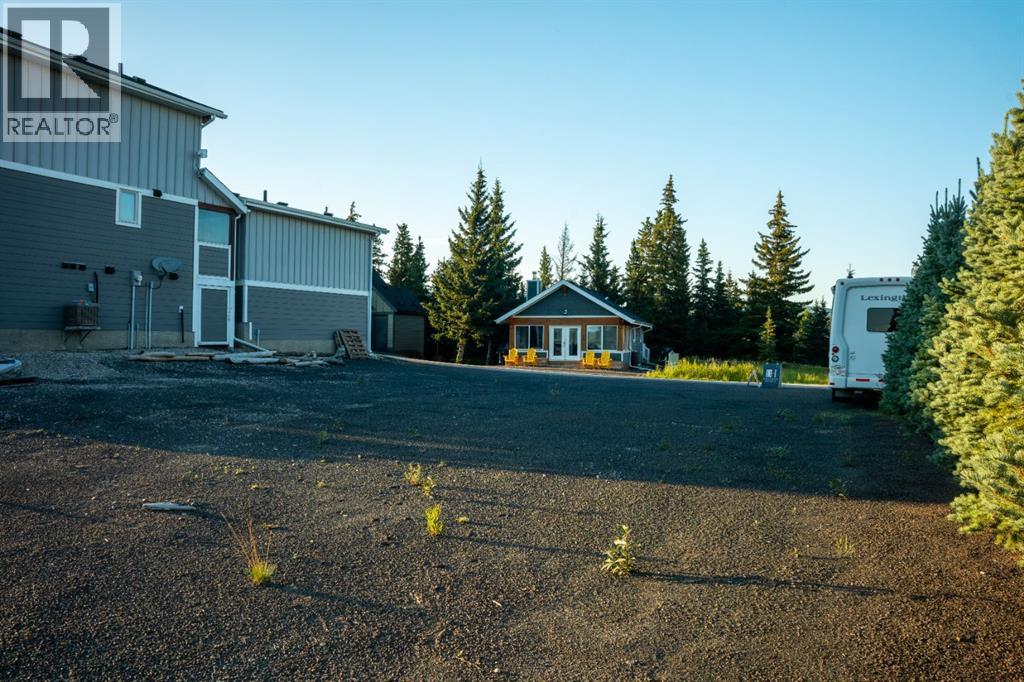 407 Cottage Club Grove, Rural Rocky View County, Alberta  T4C 1B1 - Photo 4 - A2245242
