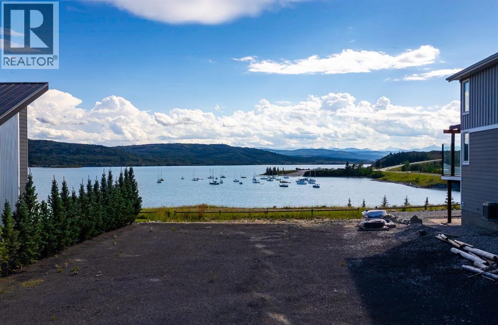 407 Cottage Club Grove, Rural Rocky View County, Alberta  T4C 1B1 - Photo 5 - A2245242