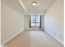 Unfurnished room featuring light wood finished floors and a textured ceiling