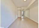 Unfurnished bedroom featuring light wood-style flooring, a closet, and a textured ceiling