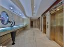 Hall featuring elevator, recessed lighting, and light tile patterned floors