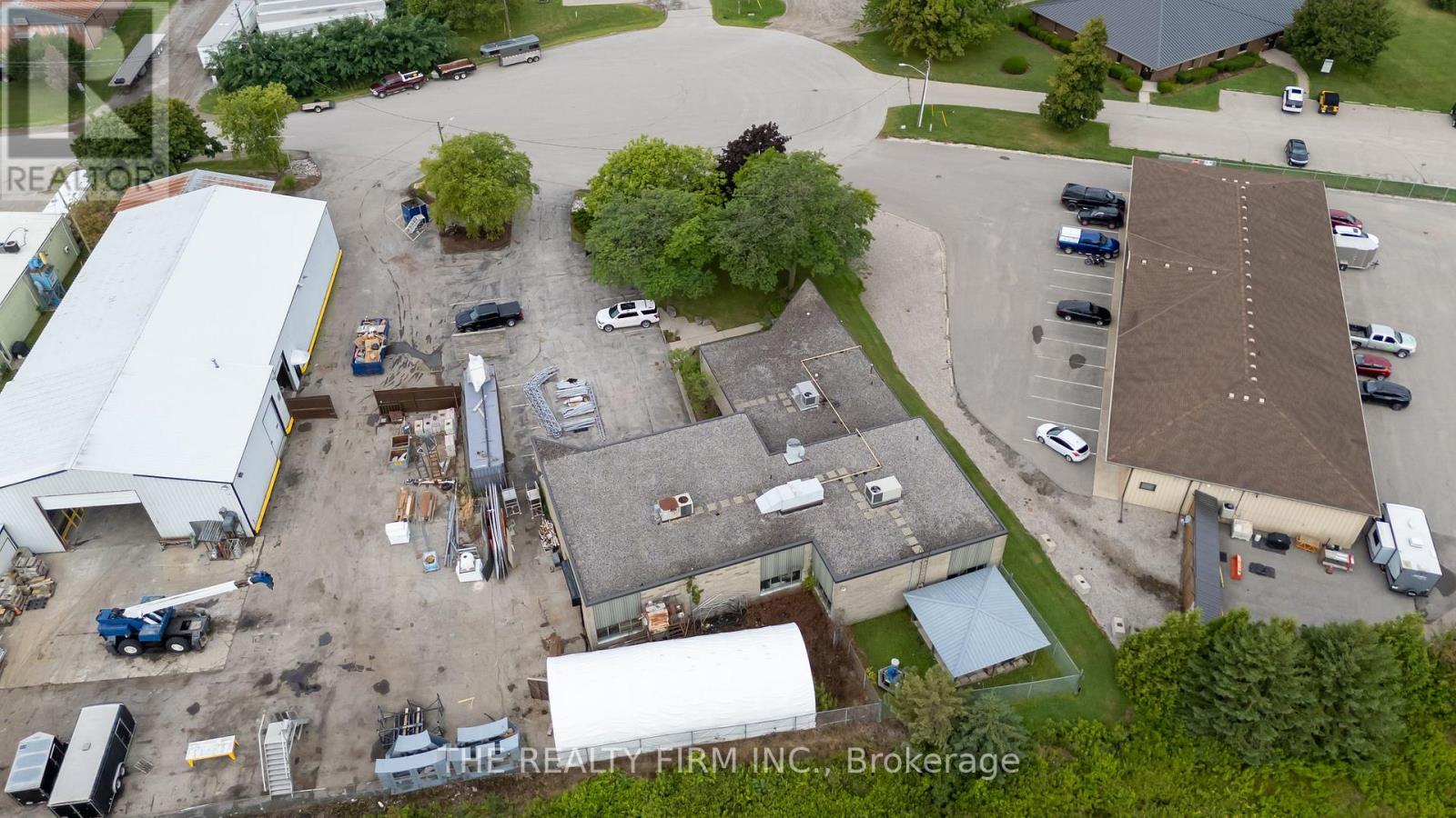 This exceptional commercial property at 11 Barrie Bivd in St. Thomas offers 5,980 sq ft of versatile space, ideal for office use or investment. Situated on a 0.54-acre irregular lot with excellent parking, frontage and visibility. Conveniently located near major highways and key intersections, it provides strong accessibility and exposure for a wide range of commercial operations. Additionally, the property can be purchased together with 9 Barrie Blvd, which offers an extra 9,523 sq ft of space predominantly suited for industrial use, creating a unique opportunity for multi-purpose expansion. (id:48254)