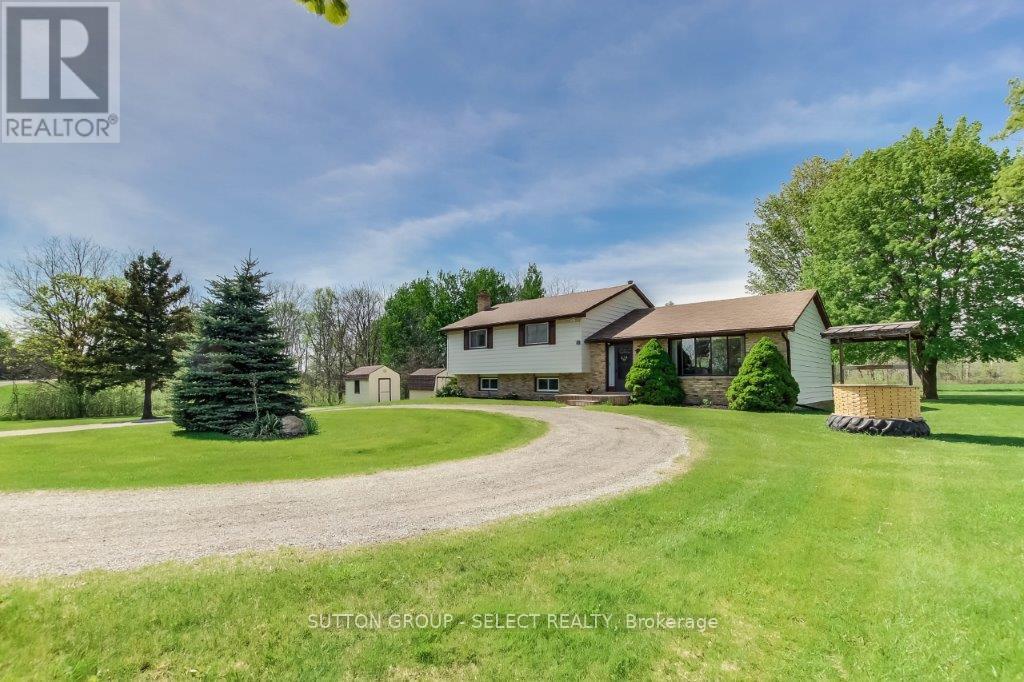 17750 Wyton Drive Thames Centre, Ontario Welcome to this country charmer with just over 7 acres of land with a house, barn & 2 sheds. The land includes approx 1.5 acres of bush and 3.5 acres of open field; perfect for a few horses or other furry friends. The zoning is A1. The barn has 2 stalls, a concrete floor, high ceiling on the main level and work benches. It has hydro and an old heating system and water lines from the house that are not currently in tact. The upper loft area is high and brightly lit offering hay and straw storage or a great place to develop. The house offers 4 bedrooms incl a large owner's suite with two closets and 2 pc ensuite. The main floor is an open concept space with large country kitchen, eating area and living room. Down to the lower 3rd level is a large family room with a sealed wood burning stove, a laundry closet and large utility room with separate entrance from the side yard. Room to roam for the whole family! The circular drive offers convenience and space for all the family cars plus the separate drive to the barn can handle a fleet. Call your agent now to schedule a showing. located close to Thorndale, Dorchester, Thamesford and London with great access to the 401. Note that all appliances and ac are in as is condition. Heat and water systems in barn are currently not working and will not be upon closing. The buyer agent's commission reduction will take place if you schedule a private showing with the listing agent and then submit an offer with another (id:48254)