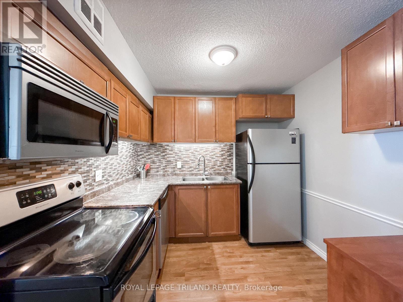 110 - 5 Jacksway Crescent, London North, Ontario  N5X 3T6 - Photo 2 - X12375679