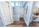 Hallway with dark hardwood / wood-style floors