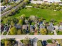View of property location with nearby suburban area