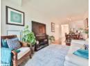 Living room featuring wood finished floors and ornamental molding